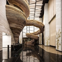 Lobby of Atrium Tower in Tel Aviv Israel What are your thoughts on this wooden staircase