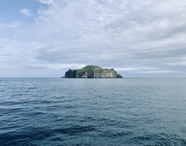 Lonely island view on the ferry to the Westman Islands Iceland  