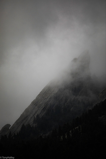 Low hanging fog wrapping around the Flatirons Boulder Colorado oc 