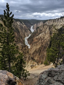 Lower Falls canyon in Yellowstone Park WY on a cloudy day looks unreal like soft pastel artwork 