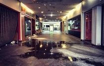 Main entrance to the abandoned Burlington Center Mall during a water main break You can even see the white fire alarm light flashing on the ceiling