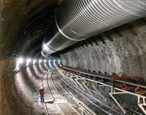 Main tunnel of the Yucca Mountain Nuclear Waste Repository  mi  km long and  ft  m wide