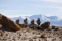 Members of the Mars Desert Research Station crew collect geologic samples 