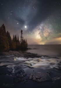 Milky Way and clouds creating a dreamy view of this waterfall at the edge of Lake Superior - Northern Michigan USA 