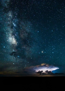 Milky Way over the Grand Canyon as lightning illuminates a cloud By Brendan Hall 