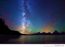 Milky Way stretches over the night sky above Jackson Lake 