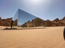 Mirrored concert hall in the middle of the desert