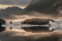 Mist and Reflections over Crummock Water of Cumbria England  Tony Bennett