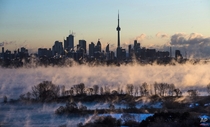 Mist rises from Lake Ontario in front of the Toronto skyline Mark Blinch 