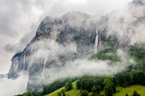Misty waterfalls in the Lauterbrunnen Valley Switzerland 