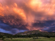 Monsoon sunset rain clouds over Escudilla Mountain in White Mountains Arizona 