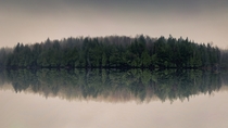 Moody lake flipped reflection 