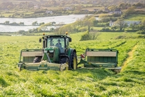 Mowing silage with a John Deere r and Krone butterfly mowers in West Cork Ireland x OC