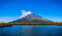 Mt Taranaki one of the most symmetrical volcanos in the world on a clear summer day New Zealand 