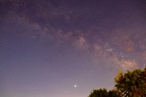 My first attempt at photographing the Milky Way with Jupiter and Saturn bottom from my backyard 