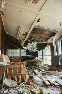 My friends family has a dilapidated lakefront property in Massachusetts The roads are too steepnarrow to get a large vehicle down to repair it This is the houses sunroom Shot on film in 
