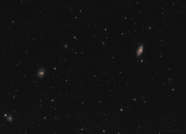 My  hour long exposure of some galaxies in Coma Berenices taken from my apartment roof 