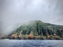 Na Pali coast under rain The famous Honopu Arch can be seen on the left From  
