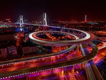 Nanpu Bridge and its km long circular junction which climbs up through  loops Shanghai 