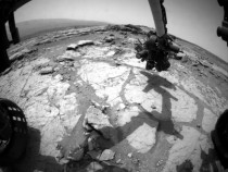 NASAs Mars rover Curiosity used its front left Hazard-Avoidance Camera for this image of the rovers arm over the drilling target Cumberland during the th Martian day or sol of the rovers work on Mars May   