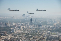 NASAs three WB-s flying over foggy downtown Houston Texas  Credit NASARobert Markowitz