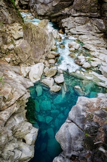 Naturally brilliant turquoise pools of the Verzasca River - Ticino Switzerland 