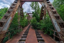 Nature taking over an abandoned railway bridge Italy 