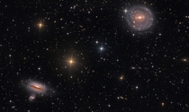 NGC  and Friends - Barred spiral galaxy NGC  top right and nearly edge-on lenticular galaxy NGC  bottom left 