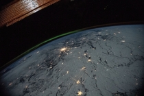 Nighttime view of the Earths limb with an aurora  January  A portion of the International Space Stations solar arrays caps this nighttime view of the Earths limb with an aurora as the orbital complex orbited  miles above Ukraine and Russia writes NASA 