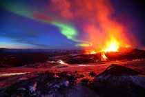 Northern Lights over an erupting volcano Eyjafjallajkull Iceland 
