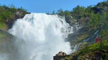 Norways Kjosfossen waterfall and the dancing lady is red 