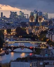 Notre-Dame Cathedral and the skyline of La Dfense seen beyond Paris France