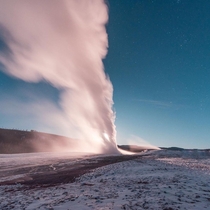 OC- Old Faithful Yellowstone National Park blasting off in front of a full moon  rising Have you been to Yellowstone 