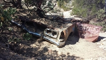 Old car found along hiking trail thats below a road 