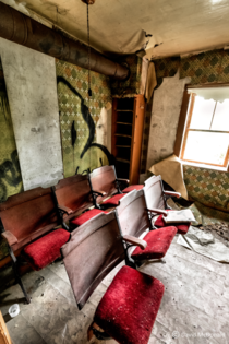 Old movie theatre seats arranged in an abandoned house NE of Toronto near Campbellford
