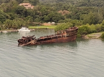 Old rusty cargo ship in Roatan Honduras oc