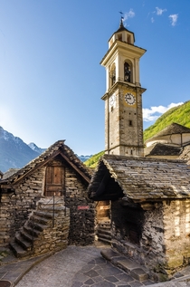 Old stone houses and bell tower in Sonogno Switzerland 