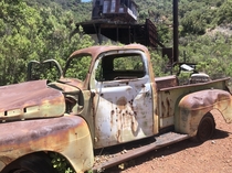 Old truck with bullet holes in front of an abandoned mercury mine Santa Barbara County