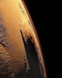 Olympus Mons on Mars the largest volcano in the solar system  almost  times higher than the Everest Bet in what year a human will first reach the top of Olympus Mons  Picture by NASA 