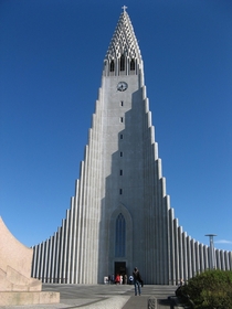 On a hilltop near Reykjavk the Hallgrmskirkja is one of the citys best-known landmarks and is visible throughout the city Architect Gujn Samelssons design of the church was commissioned in  He is said to have designed it to resemble the trap rocks mountai