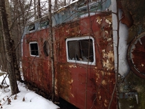 On a snowmobile trip I found an abandoned mobile home in the woods 