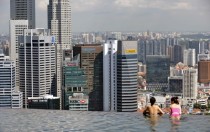 Overlooking Singapores financial district from a rooftop infinity pool 
