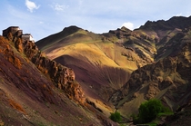 Painted Hills and a Boulder-Mounted Monastery in Ladakh region India 