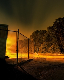 Photo I shot in the parking lot an abandoned KMart with the fence starting to fall apart