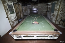 Pool Table Inside the Basement Of an Abandoned  Year Old Farm House in Ontario Canada 