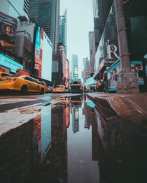 Puddle reflection in Times Square