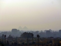 Pyramids through the smog Cairo Egypt 