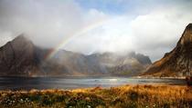 Rainbow breaking the clouds Lofoten Norway 