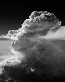 Rapidly rising cumulus clouds over the Sierra Nevada Mountains photographed from  feet