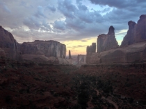 Reminds me of something from the Lion King Arches National Park with a moody storm passing through the sunset 